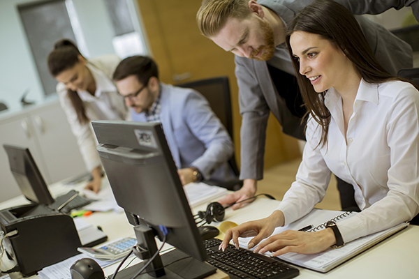 Group of young people working in the modern office