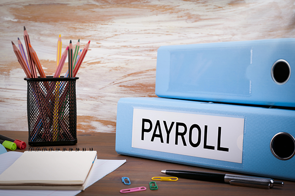 Payroll, Office Binder on Wooden Desk.